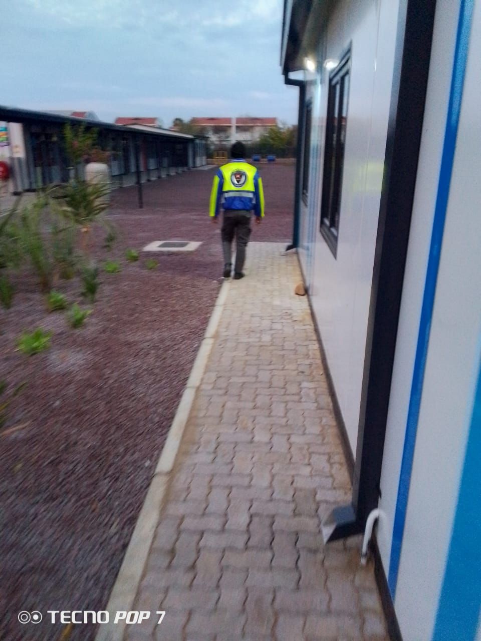 Kedith officer on night patrol between school blocks